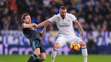 MADRID, SPAIN - JANUARY 29: Karim Benzema of Real Madrid is tackled by Asier Illarramend of Real Sociedad de Futbol during the La Liga match between Real Madrid CF and Real Sociedad de Futbol at the Bernabeu on January 29, 2017 in Madrid, Spain. (Photo by Denis Doyle/Getty Images)