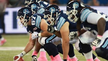 Members of the Toronto Argonauts wear pink tape in support of women's cancer awareness in the month of October. (Photo by Dave Sandford/Getty Images)