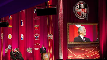 Aug 8, 2014; Springfield, MA, USA; Seven-time NBA All-Star player Alonzo Mourning is inducted into the Basketball Hall of Fame by presenter Hall of Fame coaches Pat Riley ( 08) and John Thompson ( 99) during the 2014 Naismith Memorial Basketball Hall of Fame Enshrinement Ceremony at Springfield Symphony Hall. Mandatory Credit: David Butler II-USA TODAY Sports