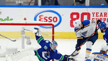EDMONTON, ALBERTA - AUGUST 17: Oskar Sundqvist #70 of the St. Louis Blues is stopped by Jacob Markstrom #25 of the Vancouver Canucks during the second period in Game Four of the Western Conference First Round during the 2020 NHL Stanley Cup Playoffs at Rogers Place on August 17, 2020 in Edmonton, Alberta, Canada. (Photo by Jeff Vinnick/Getty Images)
