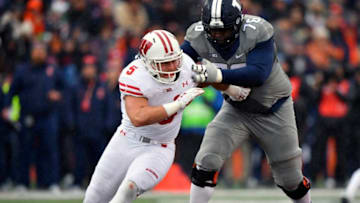 CHAMPAIGN, IL - OCTOBER 28: Wisconsin Badgers linebacker Garret Dooley (5) passes rushes against Illinois Fighting Illini offensive lineman Larry Boyd (76) during the game between the Wisconsin Badgers and the Illinois Fighting Illini on October 28, 2017 at Memorial Stadium in Champaign, Illinois. (Photo by Quinn Harris/Icon Sportswire via Getty Images)