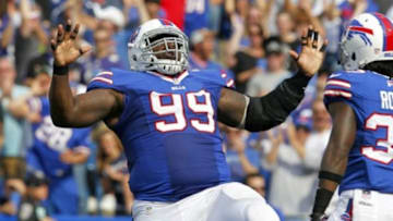 Sep 29, 2013; Orchard Park, NY, USA; Buffalo Bills defensive tackle Marcell Dareus (99) celebrates a sack on Baltimore Ravens quarterback Joe Flacco (not pictured) during the first half at Ralph Wilson Stadium. Mandatory Credit: Timothy T. Ludwig-USA TODAY Sports