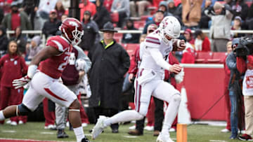 FAYETTEVILLE, AR - NOVEMBER 18: Nick Fitzgerald No. 7 of the Mississippi State Bulldogs rushes for a touchdown during a game against the Arkansas Razorbacks at Razorback Stadium on November 18, 2017 in Fayetteville, Arkansas. (Photo by Wesley Hitt/Getty Images)