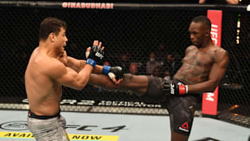 ABU DHABI, UNITED ARAB EMIRATES - SEPTEMBER 27: (R-L) Israel Adesanya of Nigeria kicks Paulo Costa of Brazil in their middleweight championship bout during UFC 253 inside Flash Forum on UFC Fight Island on September 27, 2020 in Abu Dhabi, United Arab Emirates. (Photo by Josh Hedges/Zuffa LLC)