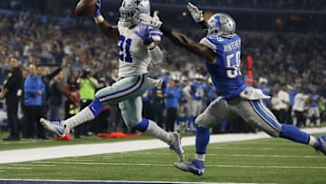 Dec 26, 2016; Arlington, TX, USA; Dallas Cowboys running back Ezekiel Elliott (21) runs for a touchdown in the third quarter against Detroit Lions middle linebacker Tahir Whitehead (59) at AT&T Stadium. Mandatory Credit: Tim Heitman-USA TODAY Sports