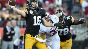 Jan 1, 2016; Pasadena, CA, USA; Iowa Hawkeyes quarterback C.J. Beathard (16) throws under pressure from Stanford Cardinal linebacker Joey Alfieri (32) during the third quarter in the 2016 Rose Bowl at Rose Bowl. Mandatory Credit: Kirby Lee-USA TODAY Sports