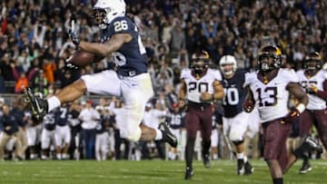Oct 1, 2016; University Park, PA, USA; Penn State Nittany Lions running back Saquon Barkley (26) leaps into the air after scoring a touchdown in overtime against the Minnesota Golden Gophers at Beaver Stadium. Penn State defeated Minnesota 29-26 in overtime. Mandatory Credit: Matthew O