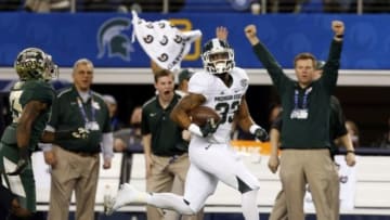 Jan 1, 2015; Arlington, TX, USA; Michigan State Spartans running back Jeremy Langford (33) runs the ball in the first quarter against the Baylor Bears in the 2015 Cotton Bowl Classic at AT&T Stadium. Mandatory Credit: Tim Heitman-USA TODAY Sports