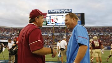 Sep 5, 2016; Orlando, FL, USA; Florida State Seminoles head coach Jimbo Fisher and Mississippi Rebels head coach Hugh Freeze talk before a game at Camping World Stadium. Mandatory Credit: Kim Klement-USA TODAY Sports