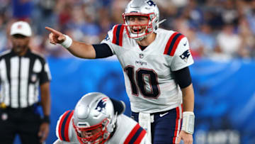 EAST RUTHERFORD, NEW JERSEY - AUGUST 29: Mac Jones #10 of the New England Patriots looks to pass the ball against against the New York Giants at MetLife Stadium on August 29, 2021 in East Rutherford, New Jersey. (Photo by Mike Stobe/Getty Images)