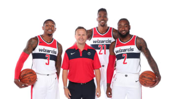 WASHINGTON, DC - SEPTEMBER 24: Bradley Beal #3, Head Coach Scott Brooks, Dwight Howard #21, and John Wall #2 of the Washington Wizards pose for a portrait during media day at the Entertainment and Sports Arena at St. Elizabeth's on September 24, 2018 in Washington, DC. NOTE TO USER: User expressly acknowledges and agrees that, by downloading and or using this photograph, User is consenting to the terms and conditions of the Getty Images License Agreement. (Photo by Ned Dishman/NBAE via Getty Images)