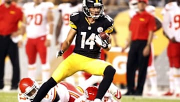 Aug 24, 2013; Pittsburgh, PA, USA; Pittsburgh Steelers wide receiver Derek Moye (14) runs after a pass reception against the Kansas City Chiefs during the fourth quarter at Heinz Field. The Kansas City Chiefs won 26-20 in overtime. Mandatory Credit: Charles LeClaire-USA TODAY Sports