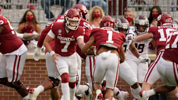 NORMAN, OK - SEPTEMBER 12: Oklahoma quarterback Spencer Rattler #7 hands off to Seth McGowan #1 who takes the ball in for a touchdown in an NCAA college football game against Missouri State on September 12, 2020, in Norman, Oklahoma. (Photo by Sue Ogrocki-Pool/Getty Images)