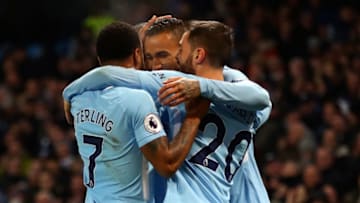 MANCHESTER, ENGLAND - DECEMBER 23: Danilo of Manchester City celebrates after scoring his sides fourth goal with his Manchester City team mates during the Premier League match between Manchester City and AFC Bournemouth at Etihad Stadium on December 23, 2017 in Manchester, England. (Photo by Clive Brunskill/Getty Images)