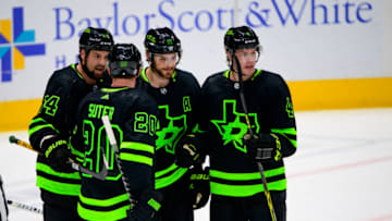 Apr 16, 2022; Dallas, Texas, USA; Dallas Stars left wing Jamie Benn (14) and center Tyler Seguin (91) and defenseman Ryan Suter (20) and defenseman Miro Heiskanen (4) celebrates a goal scored by Seguin against the San Jose Sharks during the first period at the American Airlines Center. Mandatory Credit: Jerome Miron-USA TODAY Sports