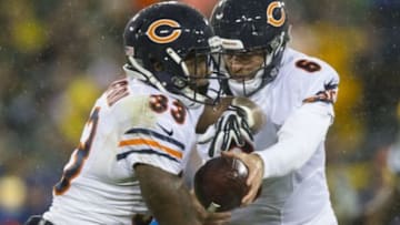 Nov 26, 2015; Green Bay, WI, USA; Chicago Bears quarterback Jay Cutler (6) hands the football to running back Jeremy Langford (33) during the second quarter of a NFL game against the Green Bay Packers on Thanksgiving at Lambeau Field. Mandatory Credit: Jeff Hanisch-USA TODAY Sports