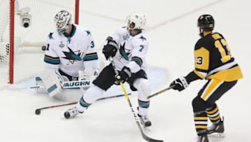 May 30, 2016; Pittsburgh, PA, USA; Pittsburgh Penguins center Nick Bonino (13) scores the winning goal past San Jose Sharks goalie Martin Jones (31) and defenseman Paul Martin (7) in the third period game one of the 2016 Stanley Cup Final at Consol Energy Center. Mandatory Credit: Charles LeClaire-USA TODAY Sports