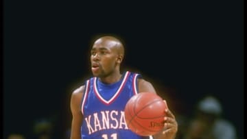29 Nov 1995: Guard Jacque Vaughn of the Kansas Jayhawks moves the ball during a game against the Virginia Cavaliers at The Palace in Aubrun Hills, Michigan. Kansas won the game, 72-66. Mandatory Credit: Jonathan Daniel /Allsport