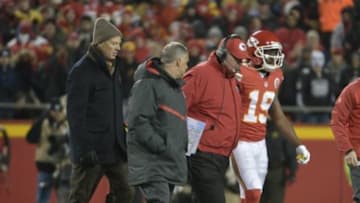 Jan 3, 2016; Kansas City, MO, USA; Kansas City Chiefs head coach Andy Reid assists wide receiver Jeremy Maclin (19) after an injury during the second half against the Oakland Raiders at Arrowhead Stadium. The Chiefs won 23-17. Mandatory Credit: Denny Medley-USA TODAY Sports