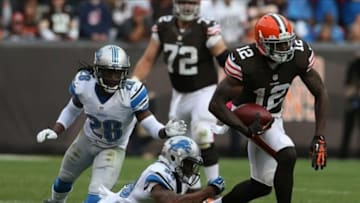 Oct 13, 2013; Cleveland, OH, USA; Cleveland Browns wide receiver Josh Gordon (12) against Detroit Lions cornerback Darius Slay (30) and cornerback Bill Bentley (28) during the fourth quarter at FirstEnergy Stadium. The Lions won 31-17. Mandatory Credit: Ron Schwane-USA TODAY Sports