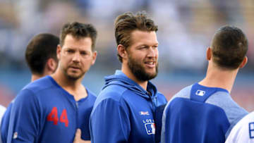 LOS ANGELES, CALIFORNIA - JULY 19: Clayton Kershaw #22 of the Los Angeles Dodgers stands between Walker Buehler #21 and Rich Hill #44 before the game against the Miami Marlins at Dodger Stadium on July 19, 2019 in Los Angeles, California. (Photo by Harry How/Getty Images)