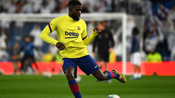 Barcelona's French defender Samuel Umtiti warms up before the start of the Spanish League football match between Real Madrid and Barcelona at the Santiago Bernabeu stadium in Madrid on March 1, 2020. (Photo by GABRIEL BOUYS / AFP) (Photo by GABRIEL BOUYS/AFP via Getty Images)