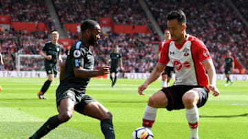 SOUTHAMPTON, ENGLAND - MAY 13: Raheem Sterling of Manchester City battles for possession with Maya Yoshida of Southampton during the Premier League match between Southampton and Manchester City at St Mary's Stadium on May 13, 2018 in Southampton, England. (Photo by Mike Hewitt/Getty Images)