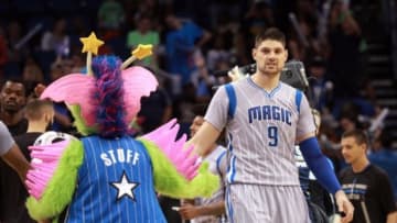 Feb 22, 2015; Orlando, FL, USA; Orlando Magic center Nikola Vucevic (9) high fives mascot Stuff after they beat the Philadelphia 76ers at Amway Center. Orlando Magic defeated the Philadelphia 76ers 103-98. Mandatory Credit: Kim Klement-USA TODAY Sports