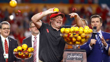 MIAMI GARDENS, FLORIDA - DECEMBER 31: Head Coach Kirby Smart of the Georgia Bulldogs throws oranges from the Orange Bowl trophy to teammates after the Georgia Bulldogs defeated the Michigan Wolverines in the Capital One Orange Bowl for the College Football Playoff semifinal game at Hard Rock Stadium on December 31, 2021 in Miami Gardens, Florida. (Photo by Michael Reaves/Getty Images)