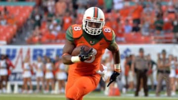 Sep 6, 2014; Miami Gardens, FL, USA; Miami Hurricanes running back Duke Johnson (8) runs against Florida A&M Rattlers defense during the first half at Sun Life Stadium. Mandatory Credit: Steve Mitchell-USA TODAY Sports