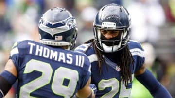 Dec 28, 2014; Seattle, WA, USA; Seattle Seahawks cornerback Richard Sherman (25) shakes hands with Seattle Seahawks free safety Earl Thomas (29) during pre game warmups against the St. Louis Rams at CenturyLink Field. Mandatory Credit: Joe Nicholson-USA TODAY Sports