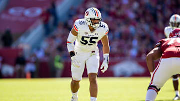 Auburn footballFAYETTEVILLE, ARKANSAS - OCTOBER 16: Eku Leota #55 of the Auburn Tigers at the line of scrimmage during a game against the Arkansas Razorbacks at Donald W. Reynolds Stadium on October 16, 2021 in Fayetteville, Arkansas. The Tigers defeated the Razorbacks 38-23. (Photo by Wesley Hitt/Getty Images)