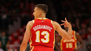 ATLANTA, GEORGIA - OCTOBER 21: Bogdan Bogdanovic #13 of the Atlanta Hawks reacts after hitting a three-point basket against the Dallas Mavericks during the first half at State Farm Arena on October 21, 2021 in Atlanta, Georgia. NOTE TO USER: User expressly acknowledges and agrees that, by downloading and or using this photograph, User is consenting to the terms and conditions of the Getty Images License Agreement. (Photo by Kevin C. Cox/Getty Images)
