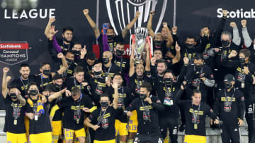 The Tigres celebrate with the Concacaf Champions League trophy in Orlando, Florida, after their 2-1 win over LAFC. (Photo by Alex Menendez/Getty Images)