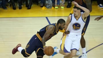 June 4, 2015; Oakland, CA, USA; Cleveland Cavaliers guard Kyrie Irving (2) moves the ball against the defense of Golden State Warriors guard Klay Thompson (11) during the second half in game one of the NBA Finals. at Oracle Arena. Mandatory Credit: Kelley L Cox-USA TODAY Sports