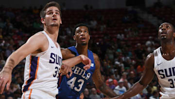 LAS VEGAS, NV - JULY 12: Dragan Bender #35 and Davon Reed #32 of the Phoenix Suns box out Chris McCollough #43 of the Philadelphia 76ers during the 2018 Las Vegas Summer League on July 12, 2018 at the Thomas & Mack Center in Las Vegas, Nevada. NOTE TO USER: User expressly acknowledges and agrees that, by downloading and or using this Photograph, user is consenting to the terms and conditions of the Getty Images License Agreement. Mandatory Copyright Notice: Copyright 2018 NBAE (Photo by Garrett Ellwood/NBAE via Getty Images)