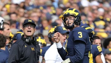 ANN ARBOR, MI - SEPTEMBER 16: Michigan Wolverines head football coach Jim Harbaugh and starting quarterback Wilton Speight #3 watch the video replay during the first quarter of the game against the Air Force Falcons at Michigan Stadium on September 16, 2017 in Ann Arbor, Michigan.(Photo by Leon Halip/Getty Images)
