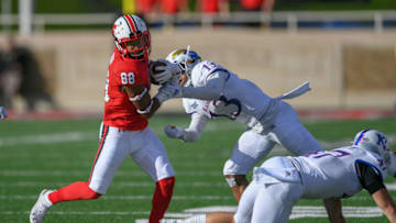 LUBBOCK, TX - OCTOBER 20: Ja'Deion High #88 of the Texas Tech Red Raiders breaks the tackle of Hasan Defense #13 of the Kansas Jayhawks during the second half of the game on October 20, 2018 at Jones AT&T Stadium in Lubbock, Texas. Texas Tech defeated Kansas 48-16. (Photo by John Weast/Getty Images)