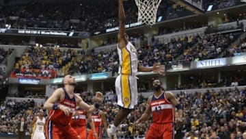 Nov 8, 2014; Indianapolis, IN, USA; Indiana Pacers forward Solomon Hill (44) lays the ball in against Washington Wizards center Marcin Gortat (4) at Bankers Life Fieldhouse. Washington defeats Indiana 97-90. Mandatory Credit: Brian Spurlock-USA TODAY Sports