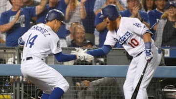 LOS ANGELES, CA - AUGUST 31: Enrique Hernandez #14 of the Los Angeles Dodgers is congratulated by Justin Turner #10 for his seventh inning home run against the Arizona Diamondbacks at Dodger Stadium on August 31, 2018 in Los Angeles, California. (Photo by John McCoy/Getty Images)
