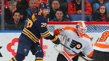 BUFFALO, NY - DECEMBER 22: Jason Pominville #29 of the Buffalo Sabres looks to deflect a shot in front of Brian Elliott #37 of the Philadelphia Flyers during the second period of an NHL game on December 22, 2017 at KeyBank Center in Buffalo, New York. (Photo by Bill Wippert/NHLI via Getty Images)