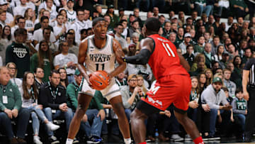 EAST LANSING, MI - FEBRUARY 15: Aaron Henry #11 of the Michigan State Spartans handles the ball while defended by Darryl Morsell #11 of the Maryland Terrapins at the Breslin Center on February 15, 2020 in East Lansing, Michigan. (Photo by Rey Del Rio/Getty Images)