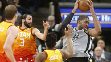 SAN ANTONIO,TX - MARCH 23 : LaMarcus Aldridge #12 of the San Antonio Spurs moves to score against Ricky Rubio #3 of the Utah jazz and Donovan Mitchell #45 of the Utah jazzat AT&T Center on March 23, 2018 in San Antonio, Texas. (Photo by Ronald Cortes/Getty Images)