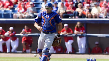 Mar 11, 2016; Melbourne, FL, USA; New York Mets catcher Travis d'Arnaud (7) chases a foul ball bunt during a spring training game against the Washington Nationals at Space Coast Stadium. Mandatory Credit: Steve Mitchell-USA TODAY Sports