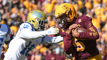 TEMPE, AZ - NOVEMBER 10: Quarterback Manny Wilkins #5 of the Arizona State Sun Devils carries the football 13 yards against defensive back Elijah Gates #18 of the UCLA Bruins to score a touchdown in the first half at Sun Devil Stadium on November 10, 2018 in Tempe, Arizona. (Photo by Jennifer Stewart/Getty Images)