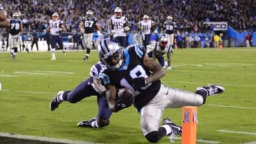 Nov 18, 2013; Charlotte, NC, USA; Carolina Panthers wide receiver Ted Ginn (19) scores the winning touchdown as New England Patriots strong safety Logan Ryan (26) defends in the fourth quarter. The Panthers defeated the Patriots 24-20 at Bank of America Stadium. Mandatory Credit: Bob Donnan-USA TODAY Sports