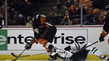 Apr 25, 2014; Anaheim, CA, USA; Anaheim Ducks right wing Corey Perry (left) moves the puck away from Dallas Stars center Tyler Seguin (right) during the second period in game five of the first round of the 2014 Stanley Cup Playoffs at Honda Center. Mandatory Credit: Kelvin Kuo-USA TODAY Sports