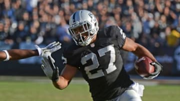 November 24, 2013; Oakland, CA, USA; Oakland Raiders running back Rashad Jennings (27) runs with the football during the second quarter against the Tennessee Titans at O.co Coliseum. The Titans defeated the Raiders 23-19. Mandatory Credit: Kyle Terada-USA TODAY Sports