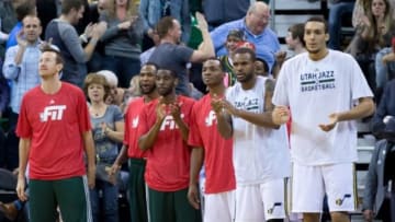 Jan 28, 2015; Salt Lake City, UT, USA; Utah Jazz players (from left) Steve Novak and Chris Johnson and Ian Clark and Elijah Millsap and Trevor Booker and Rudy Gobert react from the bench area during the second half against the Los Angeles Clippers at EnergySolutions Arena. The Clippers won 94-89. Mandatory Credit: Russ Isabella-USA TODAY Sports