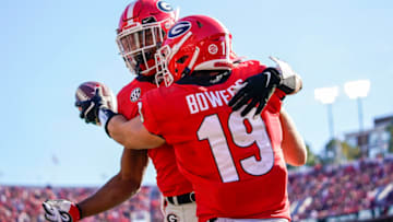 Nov 20, 2021; Athens, Georgia, USA; Georgia Bulldogs tight end Brock Bowers (19) reacts with running back Kenny McIntosh (6) after scoring a touchdown against the Charleston Southern Buccaneers during the first half at Sanford Stadium. Mandatory Credit: Dale Zanine-USA TODAY Sports